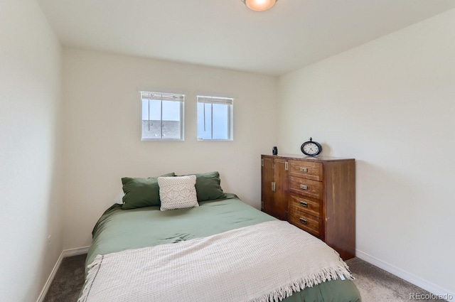 carpeted bedroom with baseboards