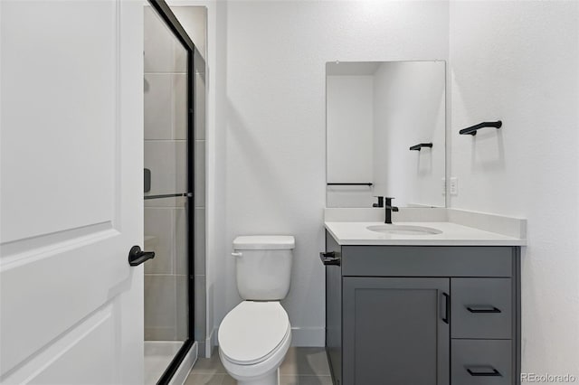 16565 Black Rose Cir, Parker, CO 80134 - bathroom featuring toilet, vanity, a shower stall, and tile patterned floors