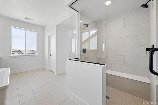 16565 Black Rose Cir, Parker, CO 80134 - bathroom featuring walk in shower, tile patterned flooring, and baseboards