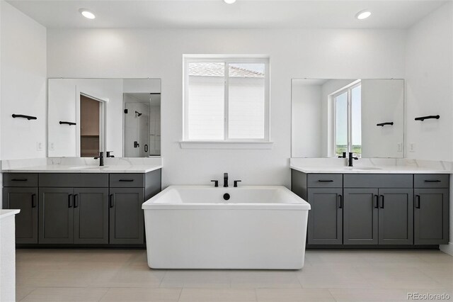 16565 Black Rose Cir, Parker, CO 80134 - full bath featuring a stall shower, two vanities, and a freestanding tub