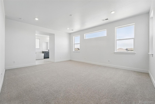 16565 Black Rose Cir, Parker, CO 80134 - empty room featuring light carpet, baseboards, and recessed lighting