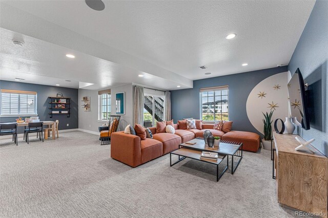 16565 Black Rose Cir, Parker, CO 80134 - living area featuring light carpet, a textured ceiling, plenty of natural light, baseboards, and recessed lighting