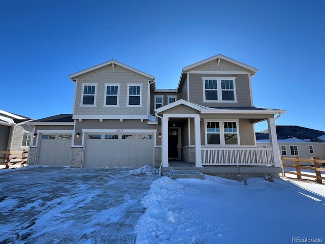 view of front of house with covered porch and a garage