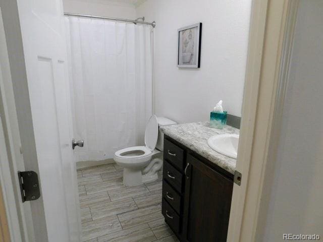 bathroom with vanity and toilet