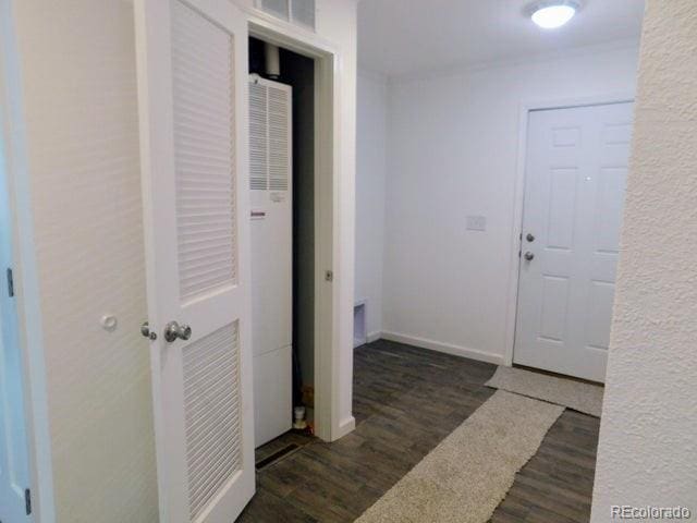 hallway featuring dark hardwood / wood-style flooring