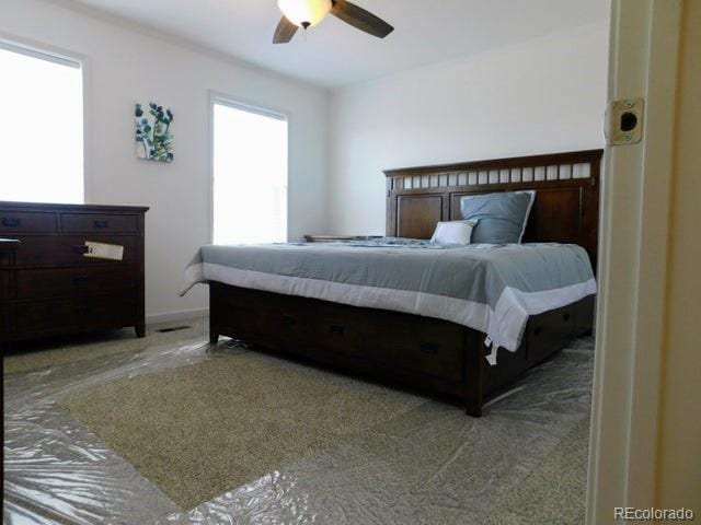 carpeted bedroom featuring ceiling fan