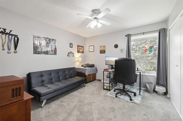 office area featuring light colored carpet, plenty of natural light, and ceiling fan