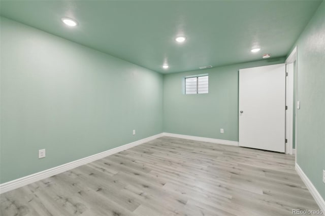 unfurnished room featuring light hardwood / wood-style floors