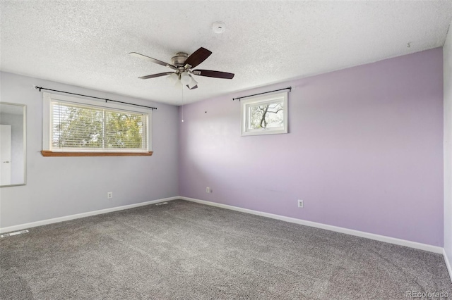 8732 W Arbor Ave, Littleton, CO 80123 - carpeted spare room featuring ceiling fan, plenty of natural light, a textured ceiling, and a smoke detector