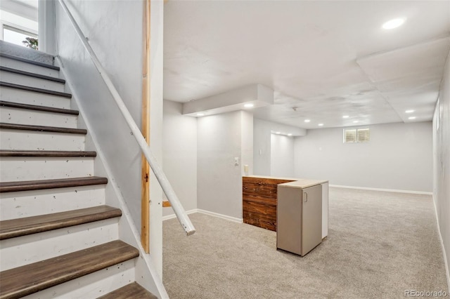 8732 W Arbor Ave, Littleton, CO 80123 - basement with carpet flooring, recessed lighting, stairs, and plenty of natural light
