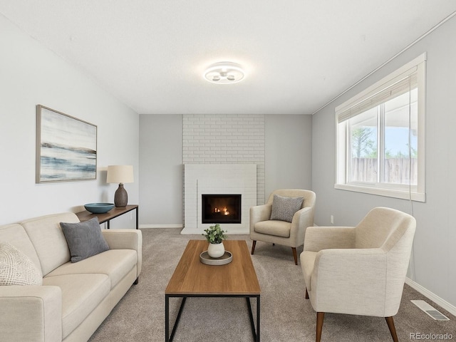 8732 W Arbor Ave, Littleton, CO 80123 - living area featuring carpet flooring and a brick fireplace