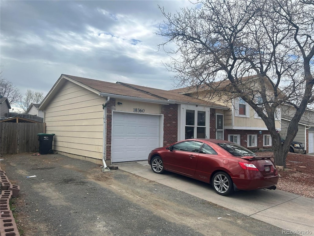 single story home with a garage