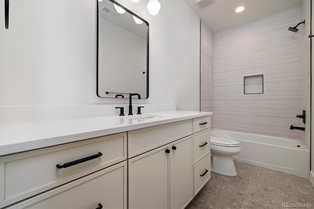 full bathroom featuring toilet, vanity, and tiled shower / bath combo