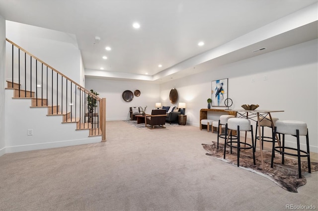 dining space with light colored carpet