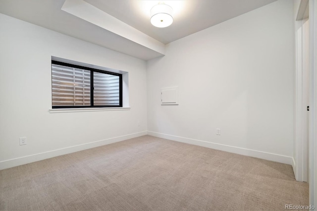 empty room featuring light carpet