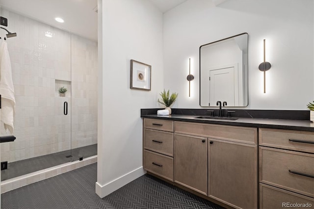 bathroom with walk in shower and vanity