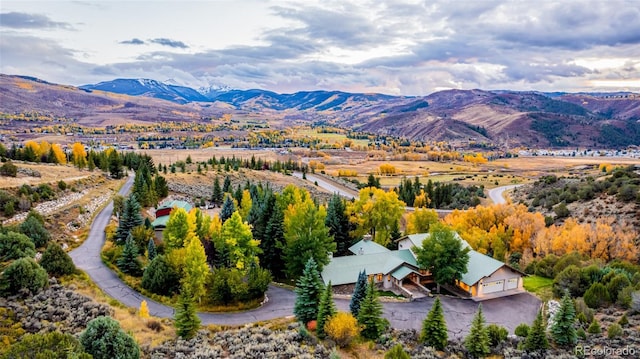 birds eye view of property with a mountain view