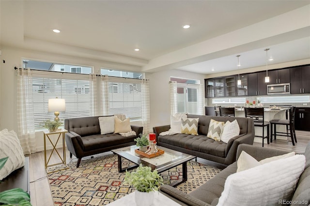 4444 N Picadilly Ct, Aurora, CO 80019 - living room featuring light wood-type flooring and recessed lighting