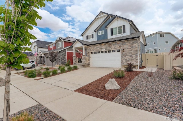4444 N Picadilly Ct, Aurora, CO 80019 - craftsman-style home featuring board and batten siding, stone siding, driveway, a garage, and a gate
