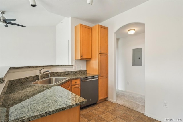 kitchen with electric panel, stainless steel dishwasher, arched walkways, a ceiling fan, and a sink