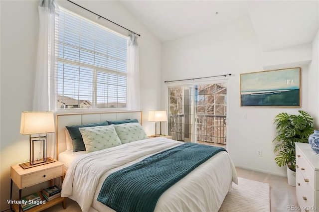 bedroom featuring access to exterior, carpet, baseboards, and vaulted ceiling