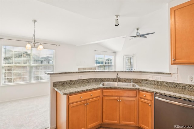 kitchen with a sink, light stone counters, carpet, dishwasher, and vaulted ceiling