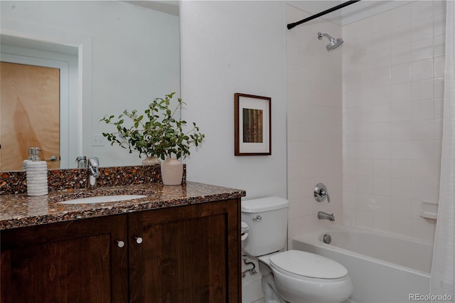 bathroom featuring toilet, vanity, and shower / washtub combination