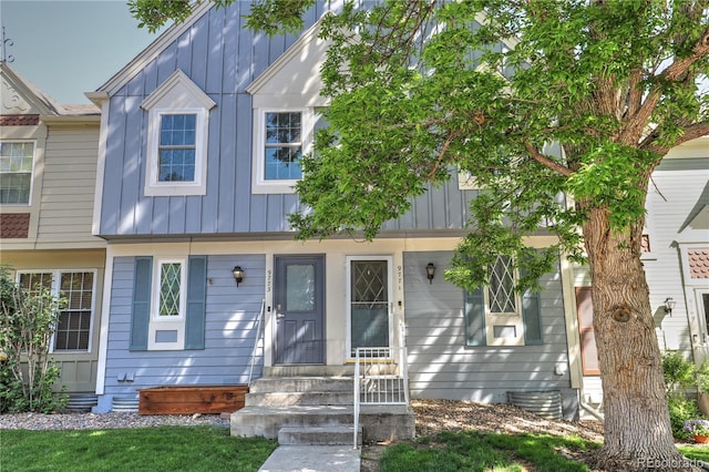 9771 W Cornell Pl, Lakewood, CO 80227 - townhome / multi-family property featuring board and batten siding and entry steps