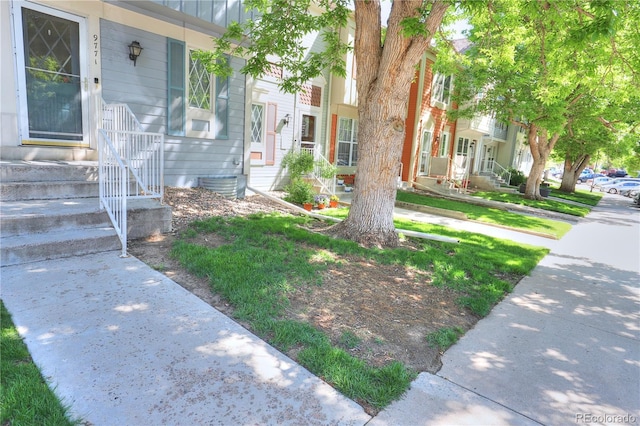 9771 W Cornell Pl, Lakewood, CO 80227 - view of front facade featuring entry steps and a porch