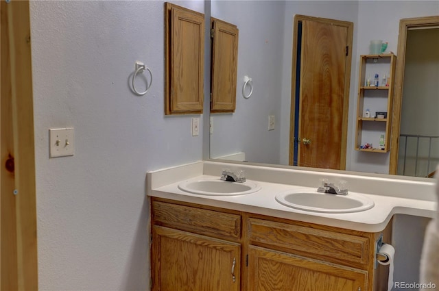 9771 W Cornell Pl, Lakewood, CO 80227 - bathroom featuring double vanity