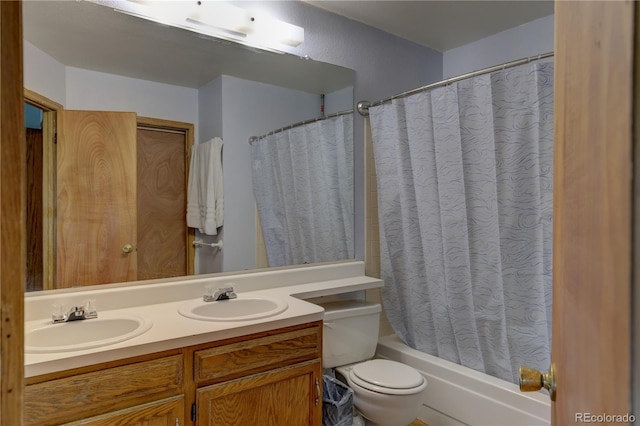 9771 W Cornell Pl, Lakewood, CO 80227 - full bath featuring double vanity, shower / bath combo, and toilet
