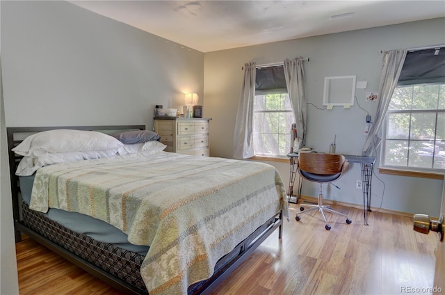 9771 W Cornell Pl, Lakewood, CO 80227 - bedroom with wood finished floors and baseboards