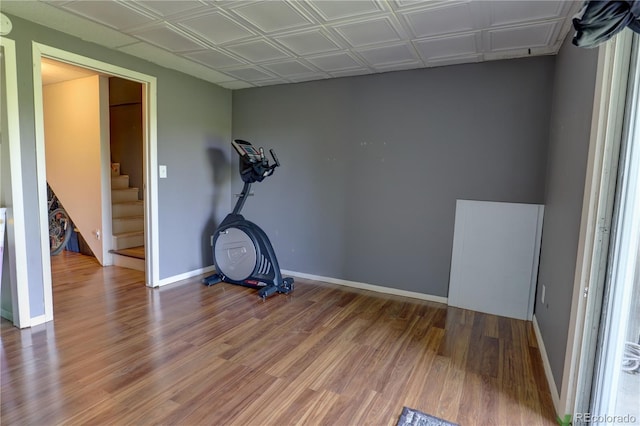 9771 W Cornell Pl, Lakewood, CO 80227 - exercise room featuring wood finished floors and baseboards