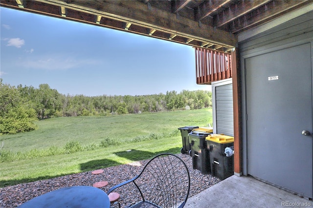 9771 W Cornell Pl, Lakewood, CO 80227 - view of grassy yard with a wooded view