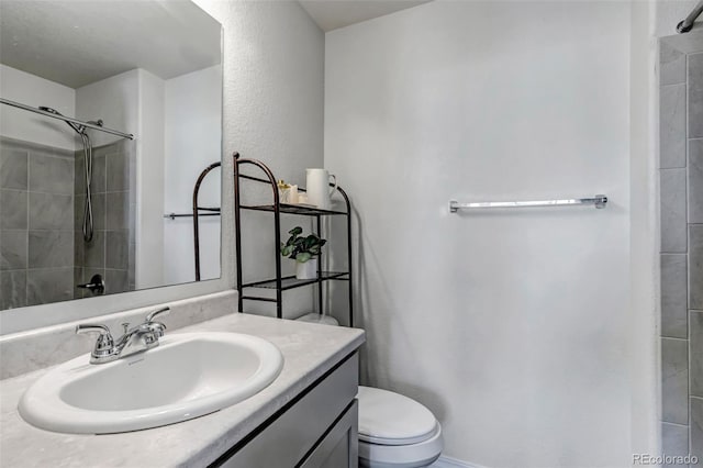 11051 Linley Way, Colorado Springs, CO 80908 - bathroom featuring vanity, tiled shower, and toilet