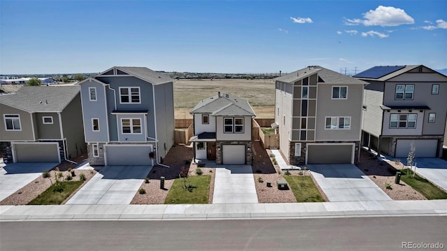 11051 Linley Way, Colorado Springs, CO 80908 - view of front of house with a garage, concrete driveway, and stucco siding