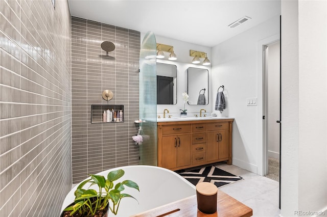 full bath featuring visible vents, a sink, a soaking tub, double vanity, and tiled shower