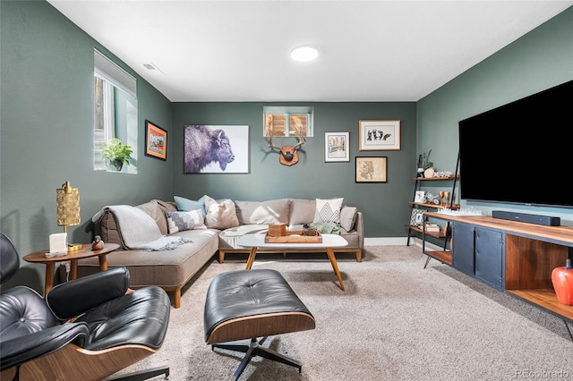 carpeted living area featuring visible vents