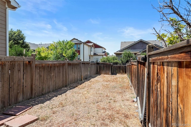 view of yard featuring a fenced backyard