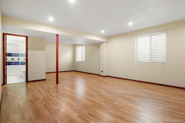 basement featuring recessed lighting, light wood-style flooring, and baseboards