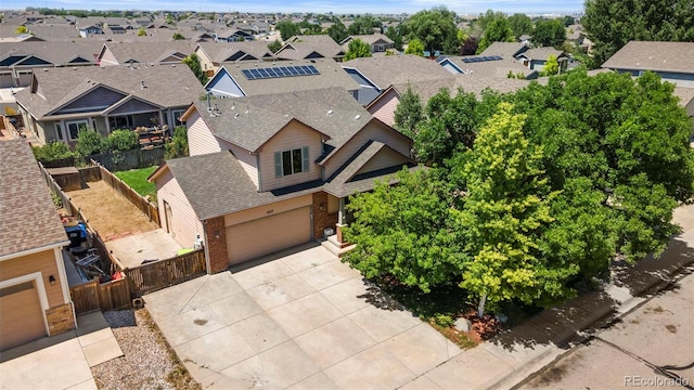 birds eye view of property with a residential view