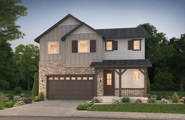 2184 S Ider Way, Aurora, CO 80018 - view of front of home with driveway, board and batten siding, stone siding, a garage, and a shingled roof