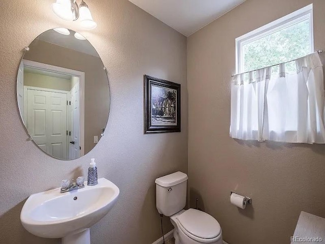 7053 Leopard Dr, Littleton, CO 80124 - half bath with toilet and a sink
