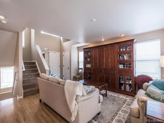 7053 Leopard Dr, Littleton, CO 80124 - living area with light wood-style floors and stairway