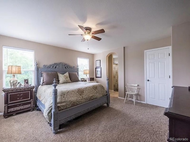 7053 Leopard Dr, Littleton, CO 80124 - bedroom featuring arched walkways, carpet, and a ceiling fan
