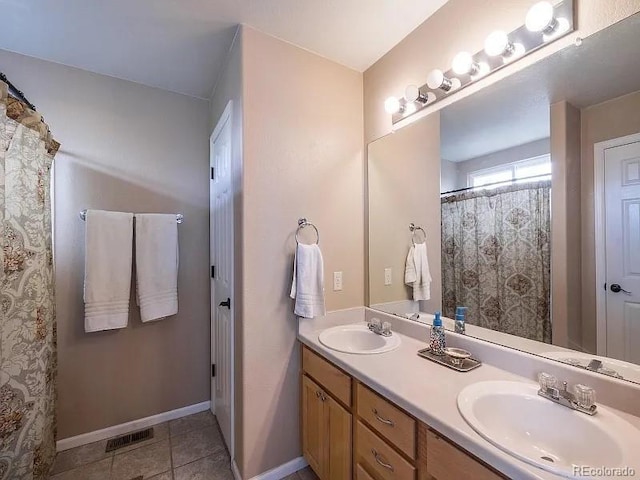 7053 Leopard Dr, Littleton, CO 80124 - bathroom with double vanity and tile patterned floors