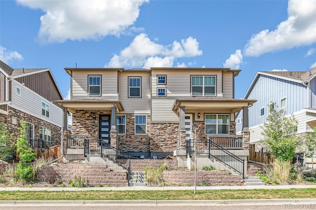 21761 E 7th Ave, Aurora, CO 80018 - view of front facade featuring covered porch, stairway, and stone siding
