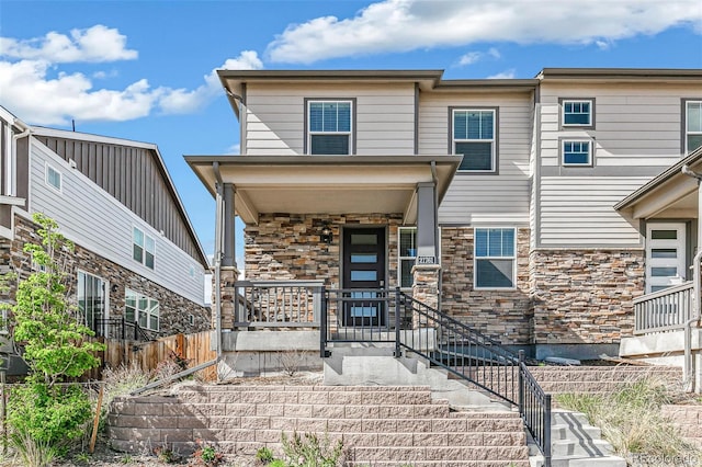 21761 E 7th Ave, Aurora, CO 80018 - view of front facade featuring stone siding and covered porch