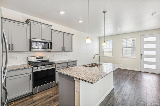 21761 E 7th Ave, Aurora, CO 80018 - kitchen featuring stainless steel appliances, gray cabinetry, a sink, decorative backsplash, and recessed lighting