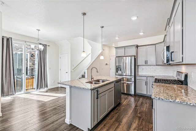 21761 E 7th Ave, Aurora, CO 80018 - kitchen featuring stainless steel appliances, gray cabinetry, a sink, dark wood finished floors, and recessed lighting